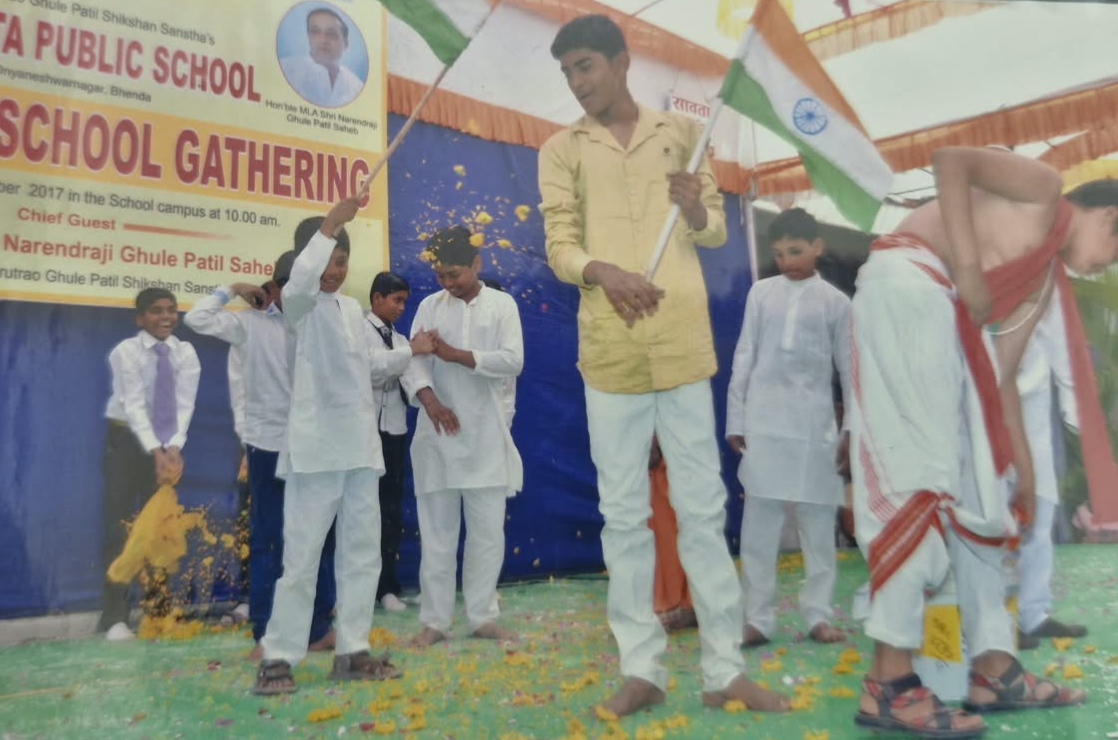 Flower petals being showered during a stage celebration